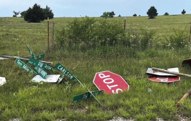 This is a pile of signs and signs that were ripped out of the ground and dumped at the side of Six Mile Road in Stephens County last month. Haley Curtsinger